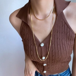 Elegant gold titanium steel snake chain necklace for women shown on a model