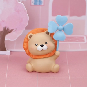 Lion car ornament with blue clover windmill accessory on a pink background