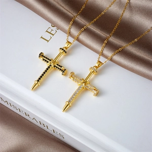 Cross necklace with gold-plated nail design featuring black and white zircon stones