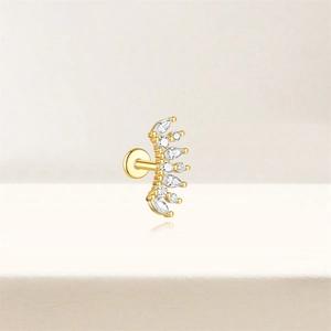 Macro view of gold lotus cartilage stud featuring marquise and round white zircons