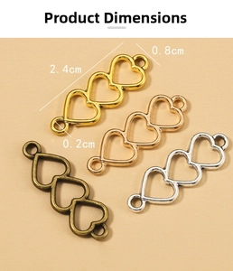 Detail view of 2.4cm heart link connectors in gold, rose gold, silver and bronze plating