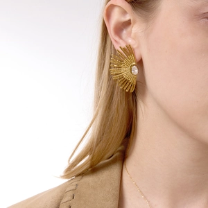 Detailed view of sunburst fan earrings with gold finish and sparkling oval zircon
