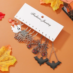Detailed set of six Halloween earrings featuring white ghosts and orange pumpkins