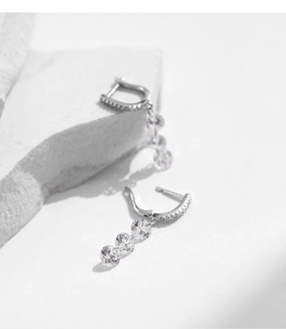 Detail of S925 sterling silver drop earrings with four graduated round cubic zirconia stones