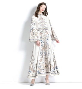 Detail of high collar lace neckline and bell sleeves on long paisley floral dress