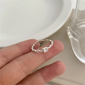 Detailed close-up of a 925 sterling silver chain ring with a square crystal gemstone
