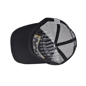 Detail of the New York embroidery under the brim and interior tag of the black trucker hat