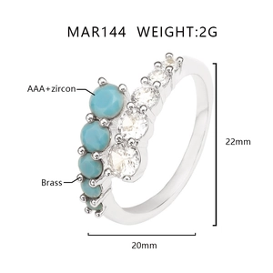 Detail view of gold-plated brass ring with blue stone and AAA zircon inlay MAR144
