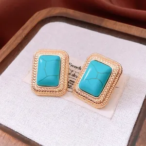 Vintage gold-plated earrings with rectangular turquoise stones and twisted texture