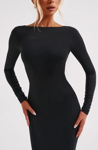 Close-up of black long sleeve bodycon dress with slim fit silhouette and backless design