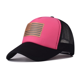 Detail of pink foam front trucker hat with leather American flag patch and black mesh