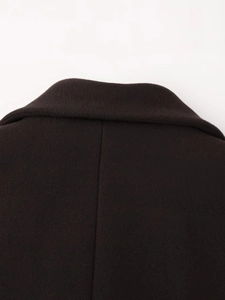 Close-up of the back collar and wool texture on a long winter coat for women