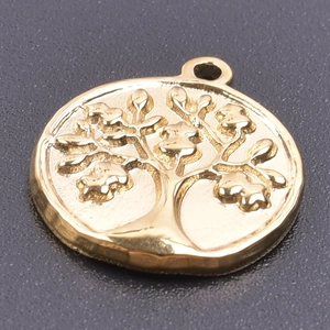 Macro shot of a golden stainless steel round pendant featuring a detailed Tree of Life