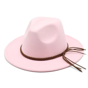 Detail of pink wool fedora hat featuring a brown braided rope band and stylish tassel