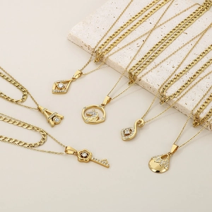Detailed view of six gold titanium steel necklaces with unique heart and geometric pendants
