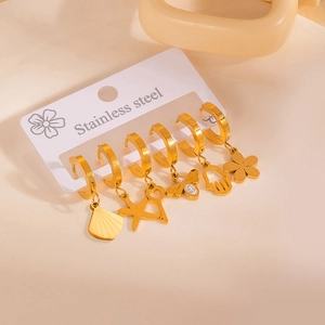 Detail of 6-piece gold stainless steel hoop earrings with shell, starfish and bee charms