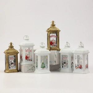 Golden and white Christmas LED lanterns with Santa illustrations and hanging ring