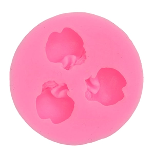 Pink round silicone mold with 3 flower-shaped cavities for fondant and chocolate decor