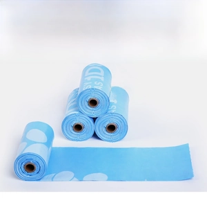 Detail showing blue biodegradable pet waste bags rolls with white easy printing