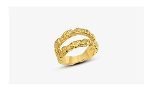 Detail of 18K gold double-layer ring featuring irregular hammered lava texture design