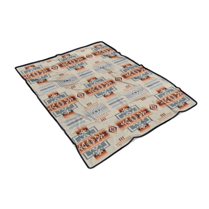 Detail of soft flannel blanket featuring a colorful geometric southwestern pattern