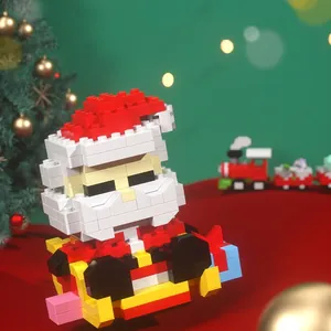Christmas Santa Claus mini building block model with gift box on festive background