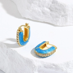 Golden U-shaped earrings with sky blue enamel and sparkling white zircon stones