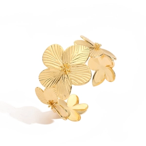 Elegant gold flower open bangle with detailed petal texture for a vintage floral jewelry look