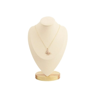 Elegant gold butterfly necklace with zircons displayed on a wooden bust stand