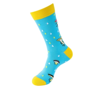 Detail of blue cotton sock with yellow heel and cute cartoon mushroom embroidery