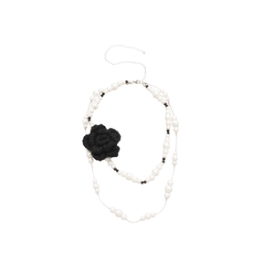 Double-layered pearl necklace with a black knitted flower and silver adjustable clasp