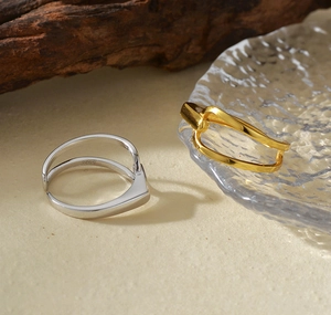 Macro detail of S925 sterling silver minimalist rings in gold and silver finishes