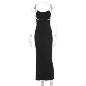 Detail of slim fit bodycon maxi dress in black with white contrast straps and U-neckline