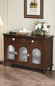 Detail of Mediterranean-style cabinet with shell handles and starfish hardware accents