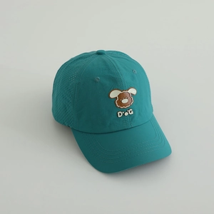 Detail view of breathable side mesh perforations on kids cartoon puppy baseball cap