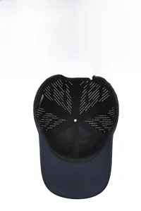 Detailed inner view of navy blue baseball cap showing breathable perforated vents