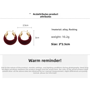 Macro view of vintage burgundy flocked U-shape earrings with gold alloy details and size data