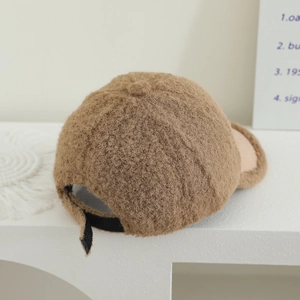 Detail of brown faux shearling texture and adjustable strap on the back of the kids baseball cap
