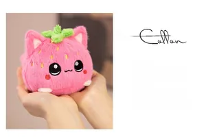 Close-up of soft pink strawberry cat plush toy showing skin-friendly velvet texture