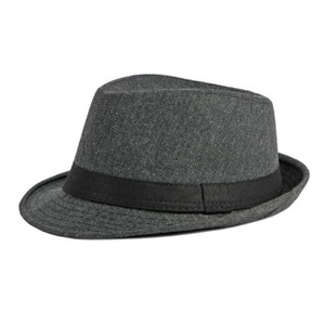 Close-up of dark grey fedora hat featuring black ribbed band and twill texture detail