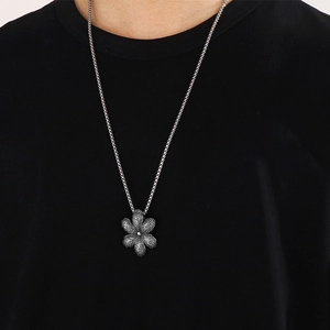 Detailed view of a vintage silver turtle pendant with intricate dot patterns on the shell