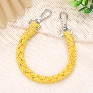 Detail of yellow hand-woven strap with durable silver metal lobster clasps and D-rings