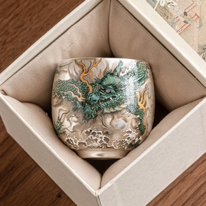 Ceramic dragon tea cup with elegant blue wave patterns in a premium gift box set