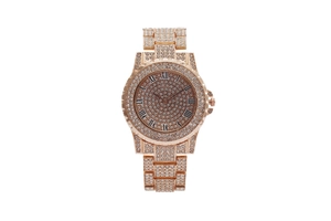Detailed macro view of the rose gold luxury watch face with Roman numerals and full diamonds