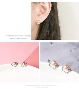 Macro shot of cloud-shaped silver earrings with natural pearls in various pastel colors