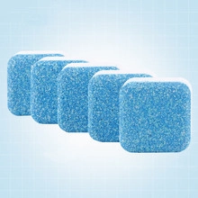 Blue square toilet cleaning effervescent tablets arranged diagonally on textured surface