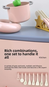 Detailed view of pink cooking pots and hanging kitchen utensils for kids' pretend play