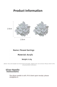 Detail view of light cyan floral acrylic stud earrings with silver pins and size markers