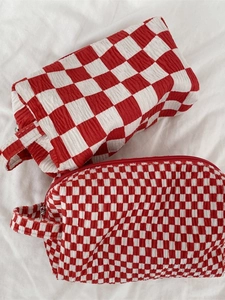 Red and white checkered seersucker makeup bag set with top handles and zip closure