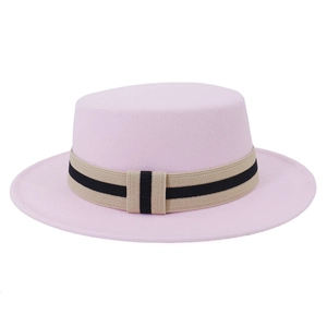 Detail view of pink flat-top wool felt hat featuring a beige and black striped band